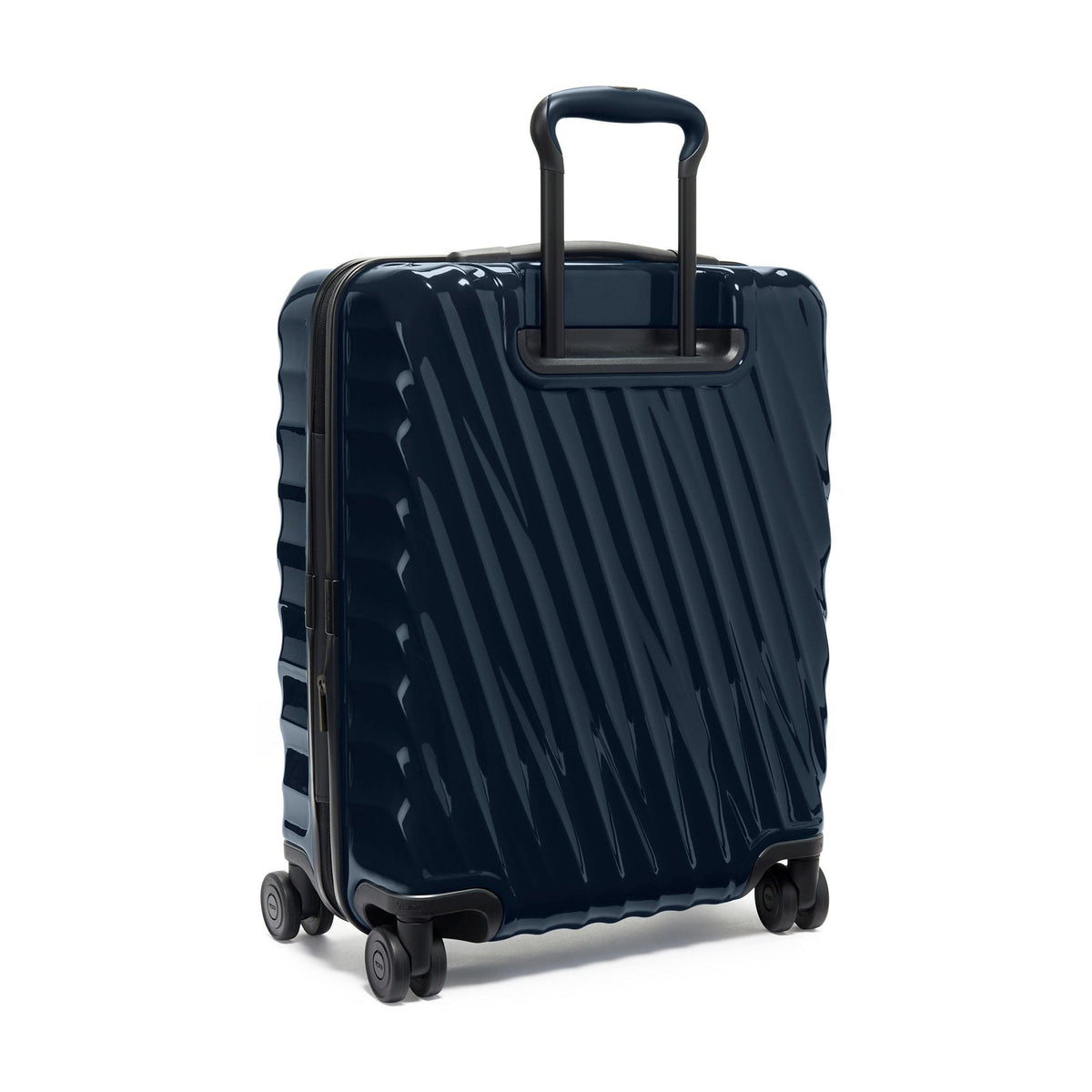Tumi 19 Degree Continental navy expandable hardside carry-on, three-quarter rear view, telescoping handle slightly raised