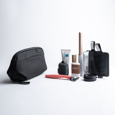 Peak Design Wash Pouch Small Black with travel toiletries for scale