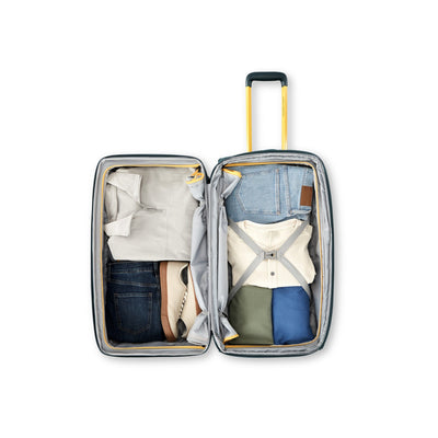High Sierra Hi-Life Medium Wheeled Duffel Green/Yellow packed open with compression straps