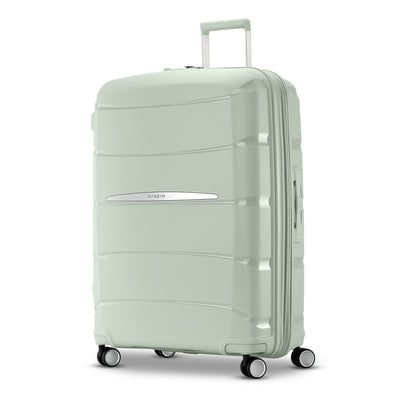 Samsonite Outline Pro sage 28" large hardside spinner, three-quarter front view, telescoping handle extended, horizontal wave-ribbed shell