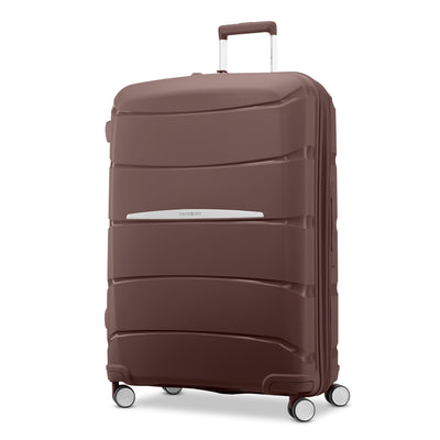 Samsonite Outline Pro cocoa chocolate mauve 28" large hardside spinner, three-quarter front view, telescoping handle extended, horizontal wave-ribbed shell