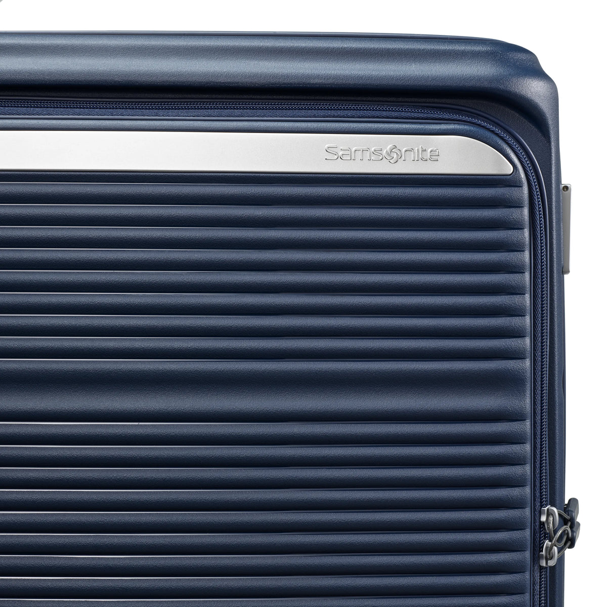 Samsonite Paralux Global midnight navy carry-on hardside spinner, ribbed shell and Samsonite logo plate