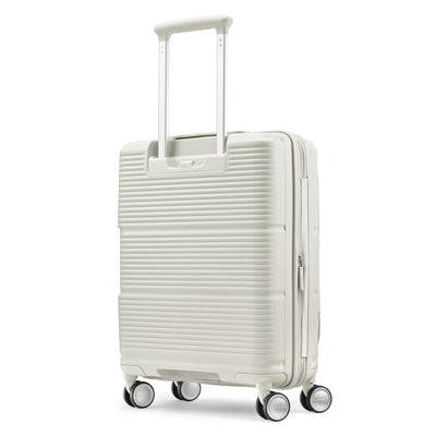 Samsonite Paralux Global stone grey carry-on hardside spinner, three-quarter rear view