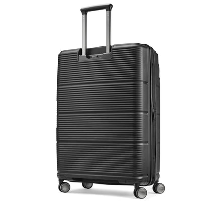 Samsonite Paralux black large checked hardside spinner, three-quarter rear view