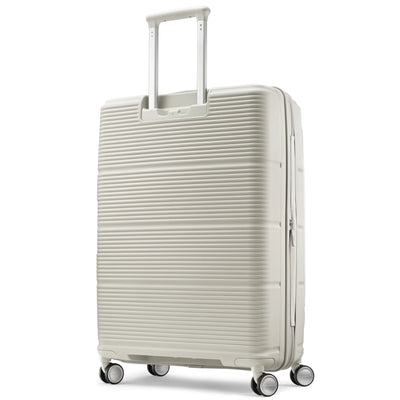 Samsonite Paralux stone grey large checked hardside spinner, three-quarter rear view