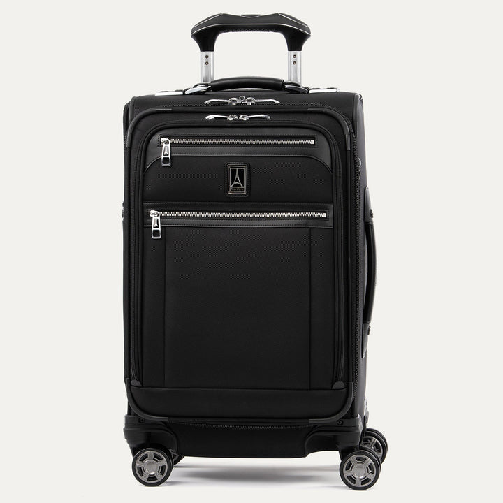 Featured image: Travelpro Platinum Elite shadow black 21" carry-on expandable softside spinner, front view, telescoping handle slightly raised, dual front zip pockets and Travelpro plaque