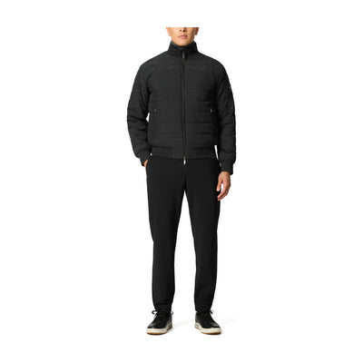 Tumi Men's Packable Puffer Jacket in Black, front view on model